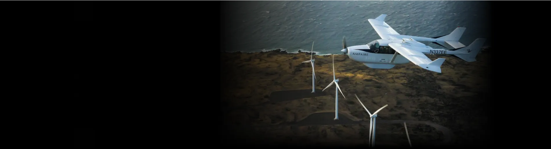 An airplane flies over a field of wind turbines. The photo is placed in a panoramic banner, with a gradient overlay that lessens the visual impact of the black bars