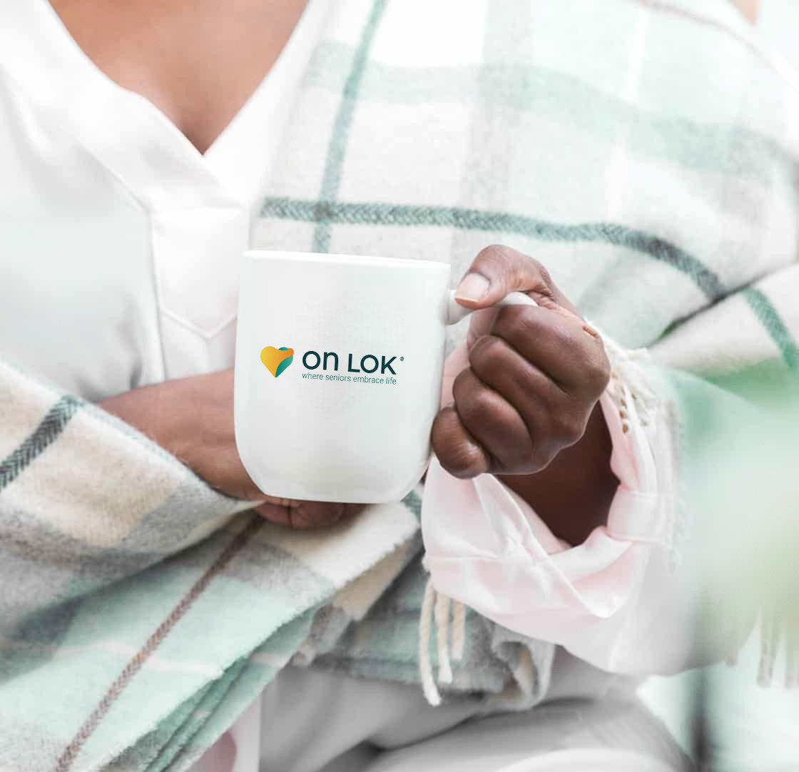 Coffee cup with OnLok logo on it