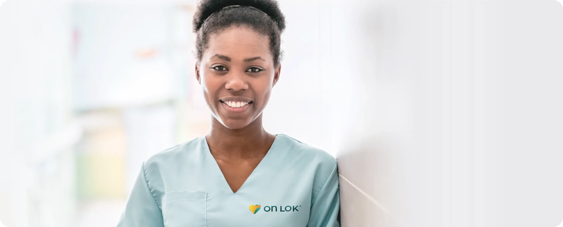 Photo of nurse with OnLok branded scrubs