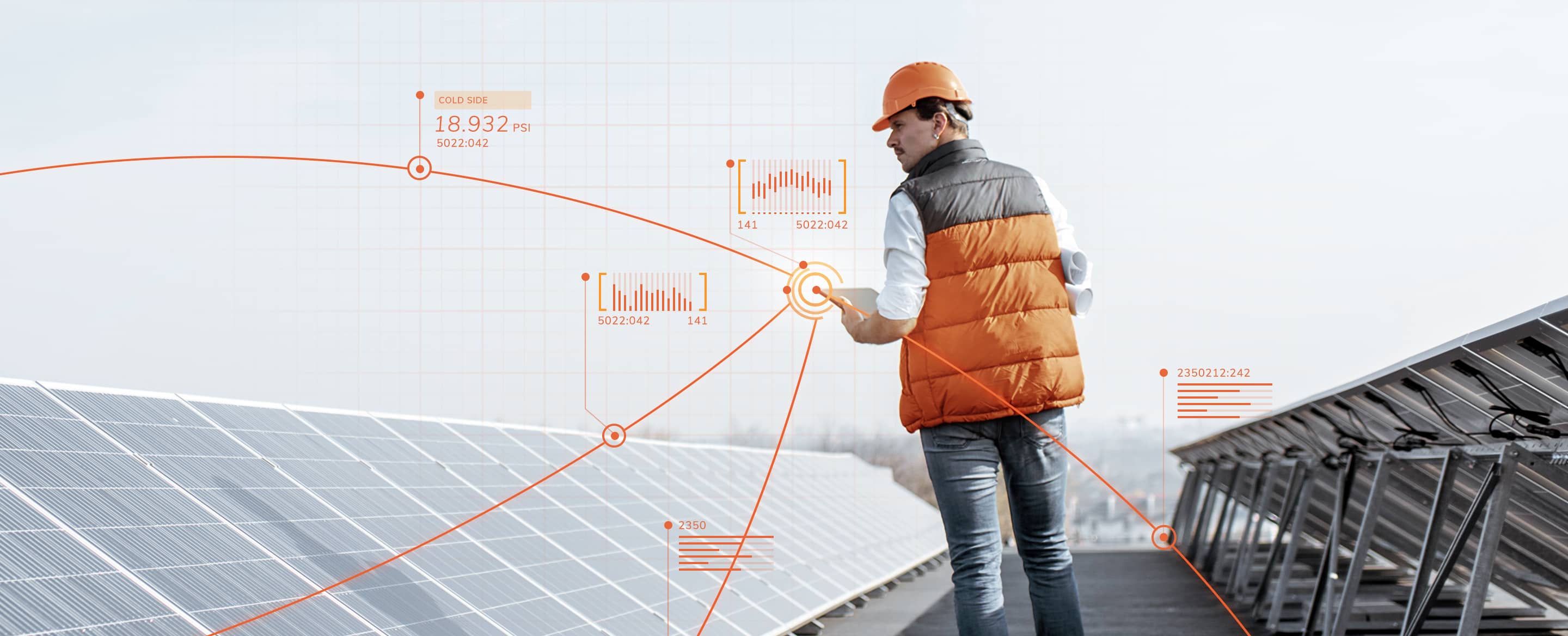 A worker inspecting a solar panel array
